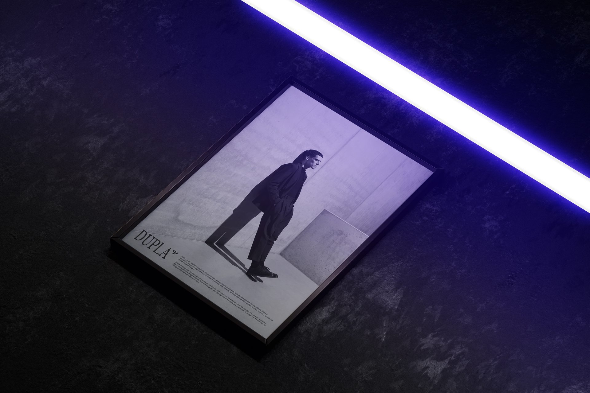 Framed Dupla editorial poster under a neon light