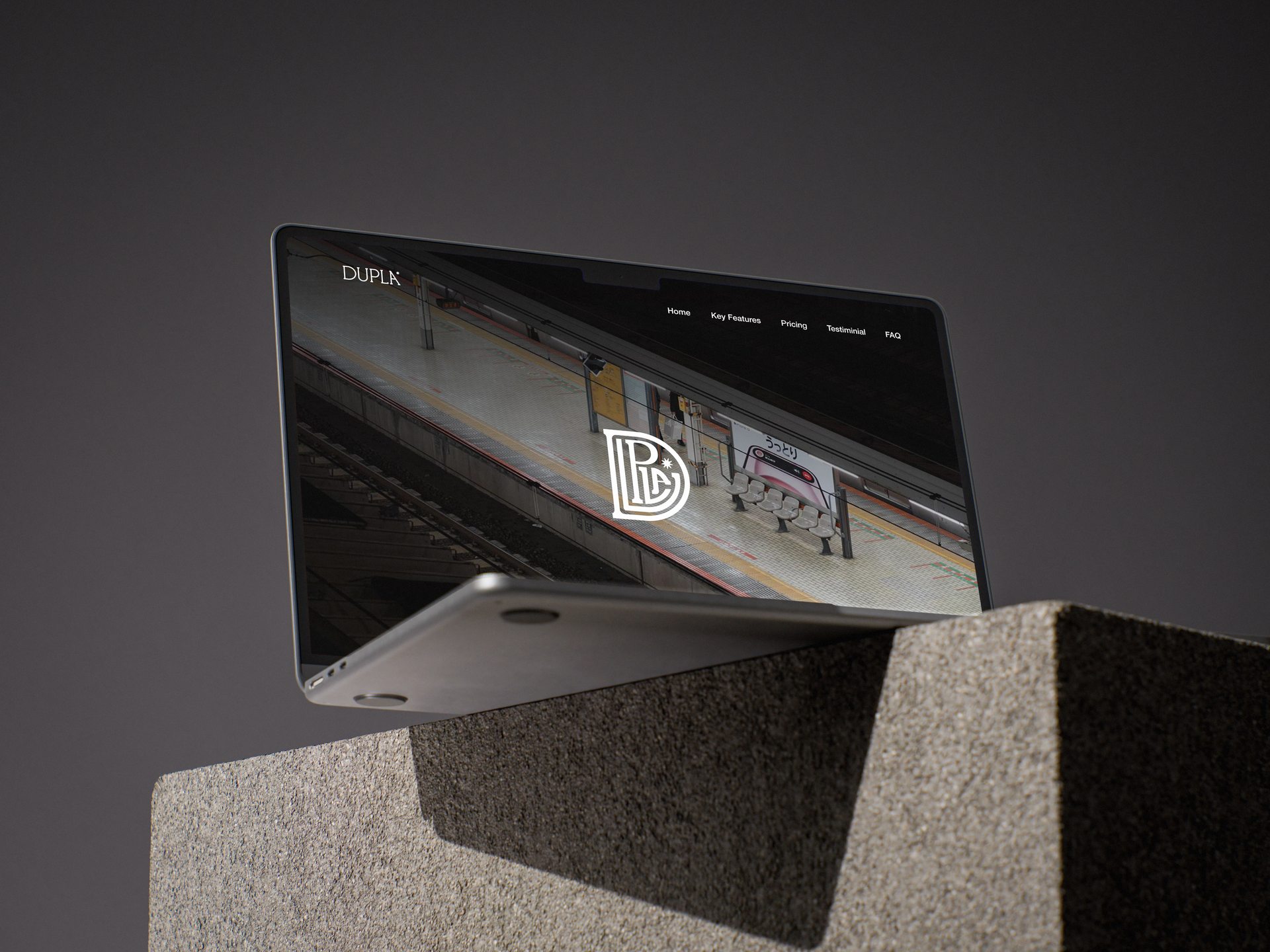 Dupla website shown on a laptop