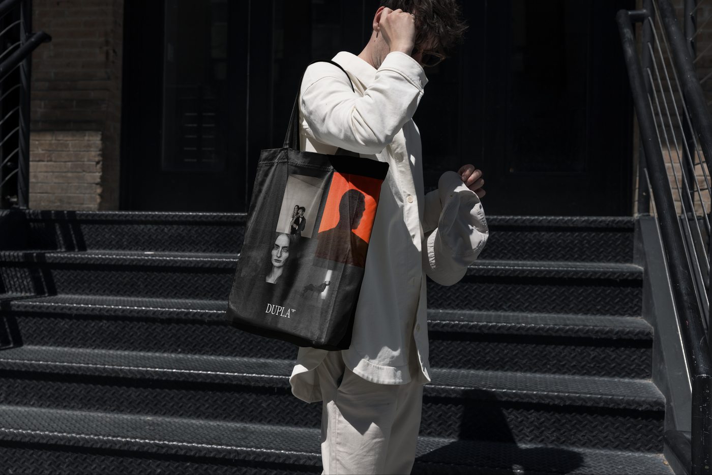 Dupla black tote bag worn on the street