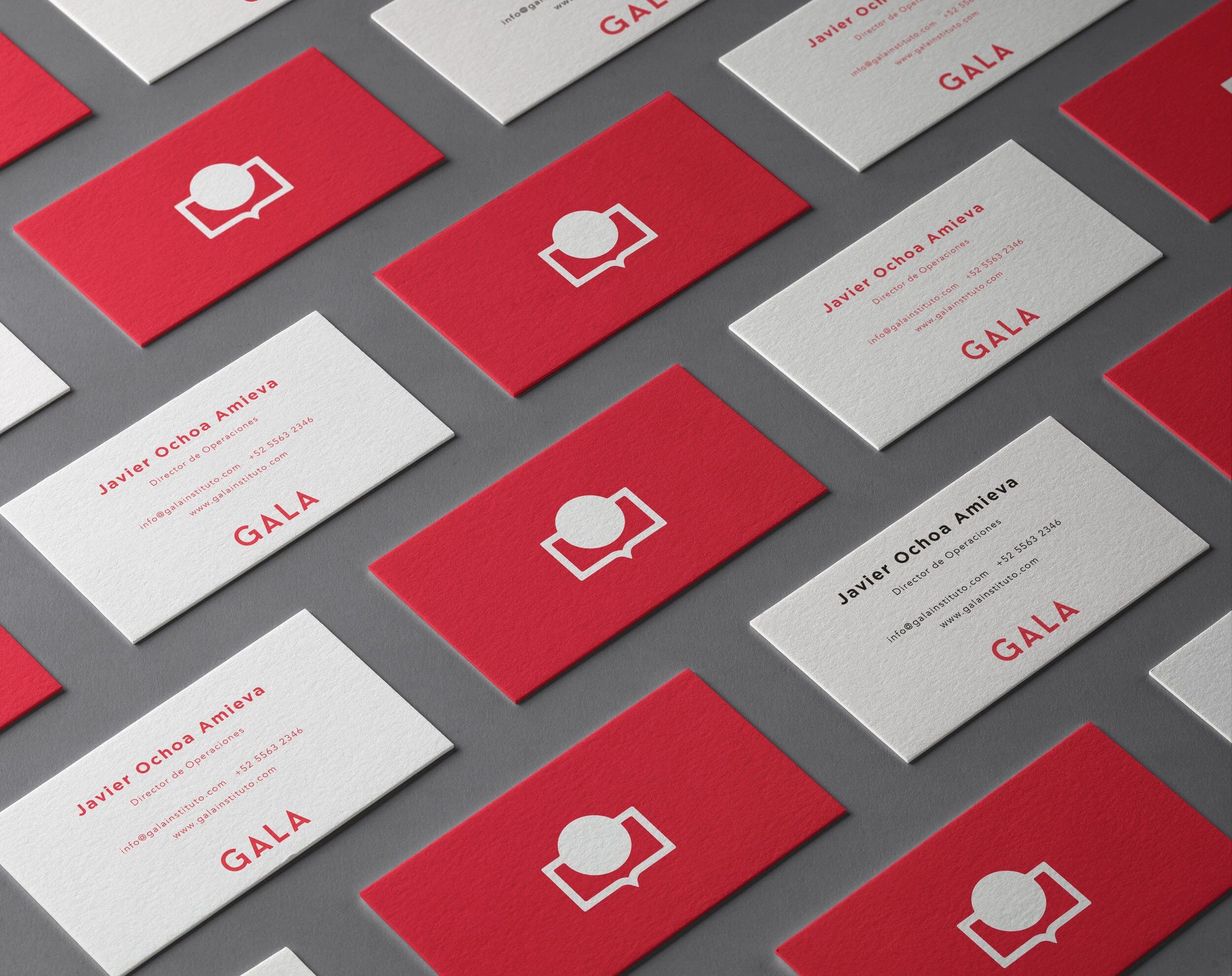 Rows of GALA business cards in red and white