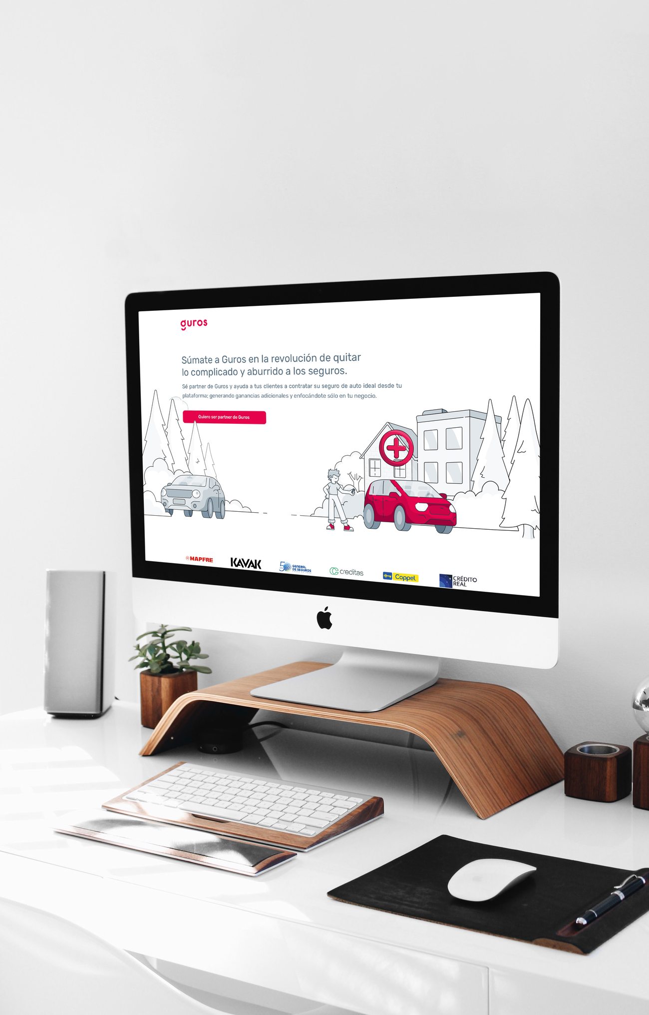 Guros website homepage with partner logos, shown on an iMac