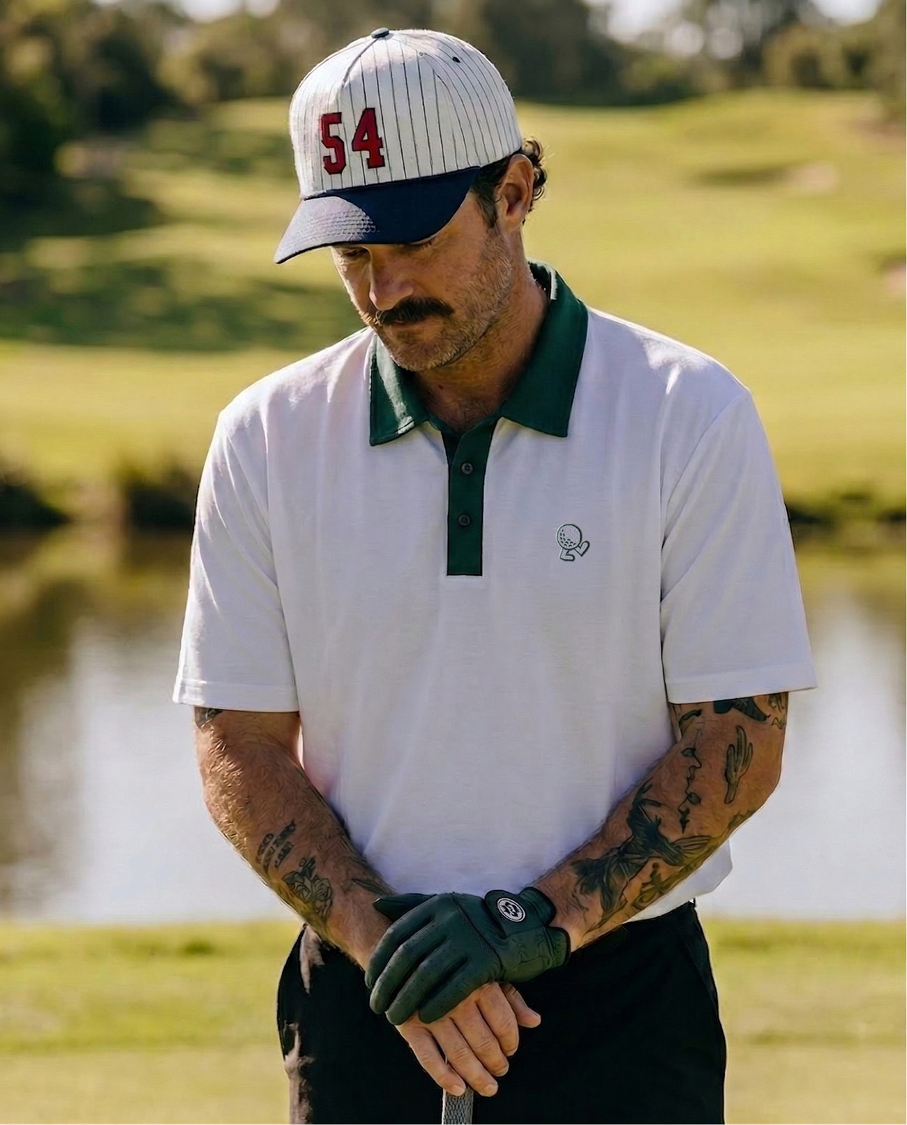 Player wearing the OB Golf Club polo on the course