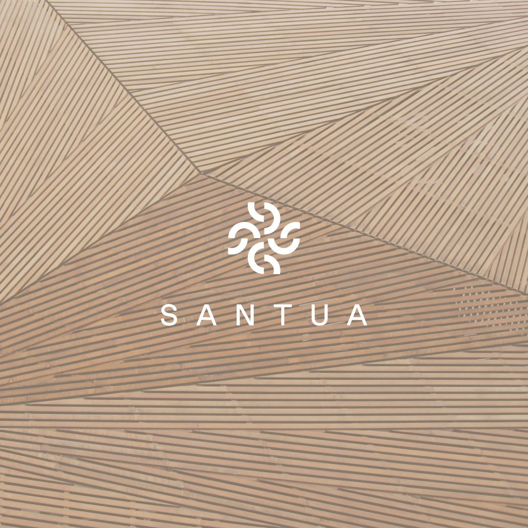 Santua wordmark over a wood slat wall